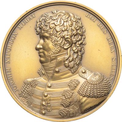 une image représentant une médaille d'or sur laquelle figure le portrait d'un homme