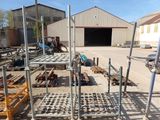 a lot of steel racks and pallets in a yard