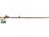 an old fashioned brass handle with a green tag on it