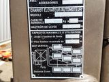a sign on the side of a machine that is on the ground