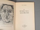 an open book with a drawing of a woman ' s face on it