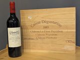 a bottle of wine sitting on a wooden table