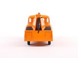 an orange toy truck that is sitting on a white surface