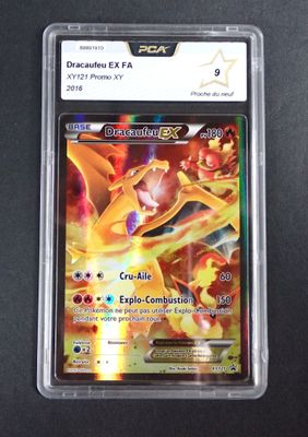 the pokemon card is in a plastic case on a black surface