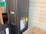 a refrigerator and a refrigerator freezer in a garage
