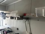 a kitchen with a lot of clutter on the counter