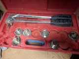 a tool set in a red case on a table