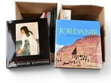 two books in a box on a white surface