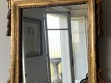 a mirror hanging on the wall in a room