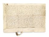 a piece of parchment with writing on it