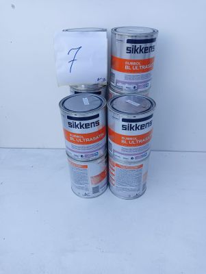 three cans of silkker ' s white paint are stacked on top of each other