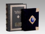a black book with a blue stone in the middle of it