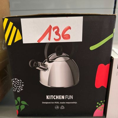 a box with a tea kettle on it on a shelf