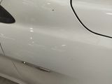 a close up of a car door handle with a sticker on it