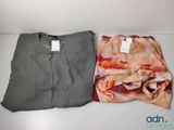 two pieces of clothing sitting on top of a table next to each other