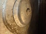 a close up of a fire hydrant in a dirty room