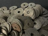 a pile of silver coins sitting on a table