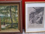 two framed pictures of horses in a wooded area next to a red wall