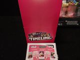 a pink box with a picture of a cell phone inside of it