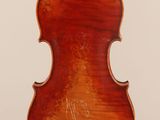 an antique violin with a wooden back and bow