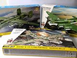 three model airplanes sitting on a table next to each other