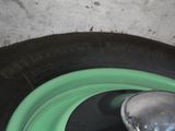 a close up of a tire with a green rim