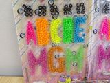 two bags of beads and a bag of beads on a table