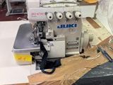 a sewing machine that is sitting on a table in a room
