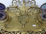 a gold plate with a clock on it on a table