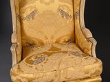 pair of louis xv style armchairs and a table