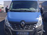 a blue van that is parked in a parking lot