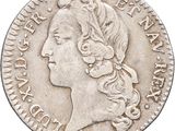 a close up of a coin with a woman ' s face on it