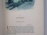 an open book with a picture of a dog laying on the ground
