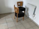 a chair and a table in the corner of a room