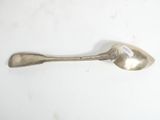 a spoon that is sitting on a table