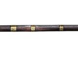 a baseball bat that is laying on a white surface