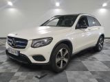 a white mercedes gle is parked on a checkered floor