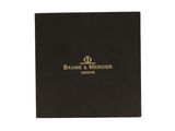 a black box with a gold logo on it
