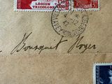 a piece of brown paper with stamps on it