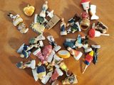 a pile of small figurines sitting on a wooden table