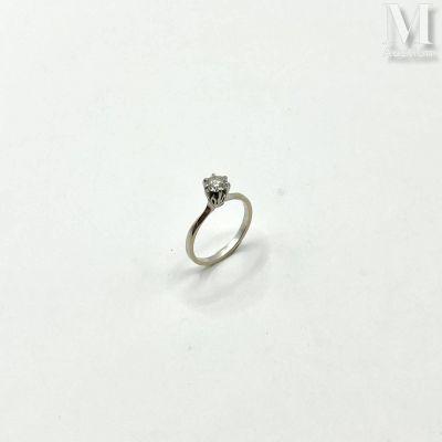 an image of a diamond ring on a white surface