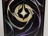 a close up of a box with a black and gold design on it