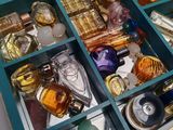 many different types of perfumes in a blue box