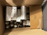 a cardboard box filled with batteries and a box of batteries