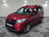 the red van is parked on a checkered floor in the garage