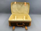a suitcase that is open on a gray surface