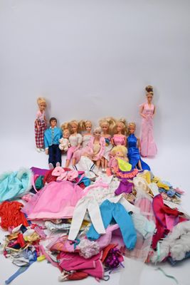 a lot of barbies and other dolls on a white background