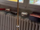 a lamp that is sitting on the floor next to a radiator