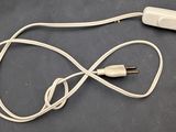 a cord that is connected to a charger on a table