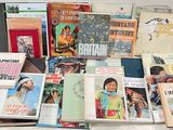 a lot of books that are sitting on a table